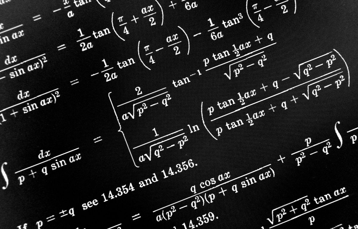 Large number of mathematical formulas on a black background