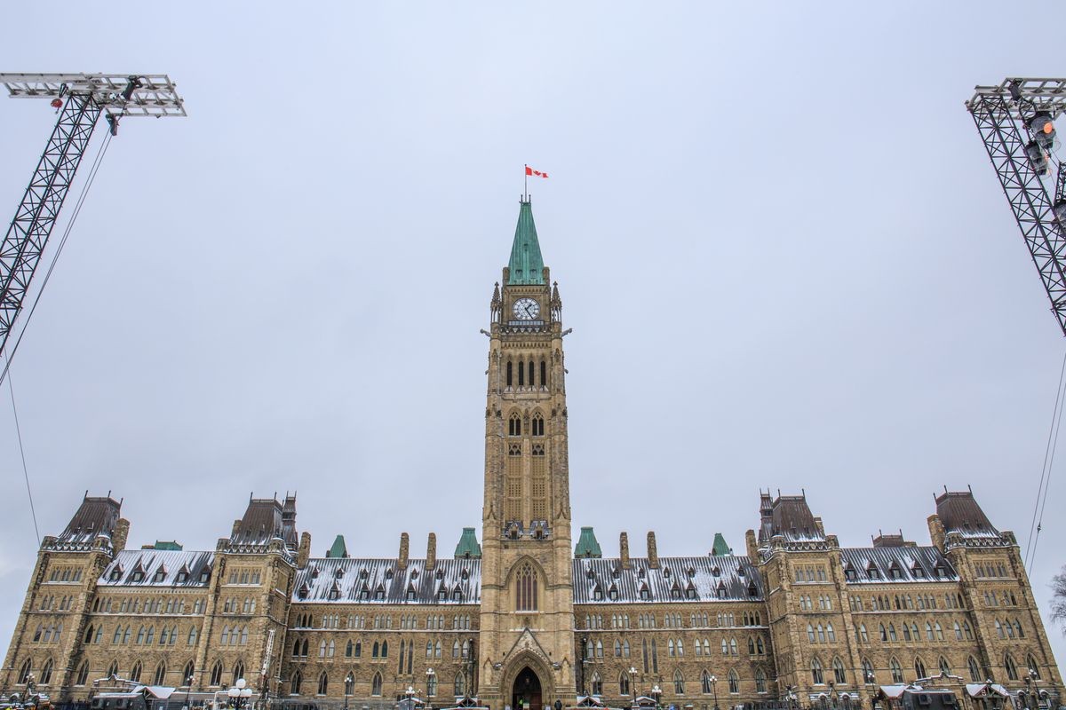 The Peace Tower stands at the center of the Parliament of Canada under snow clouds in the capital Ottawa, Ontario, Canada.